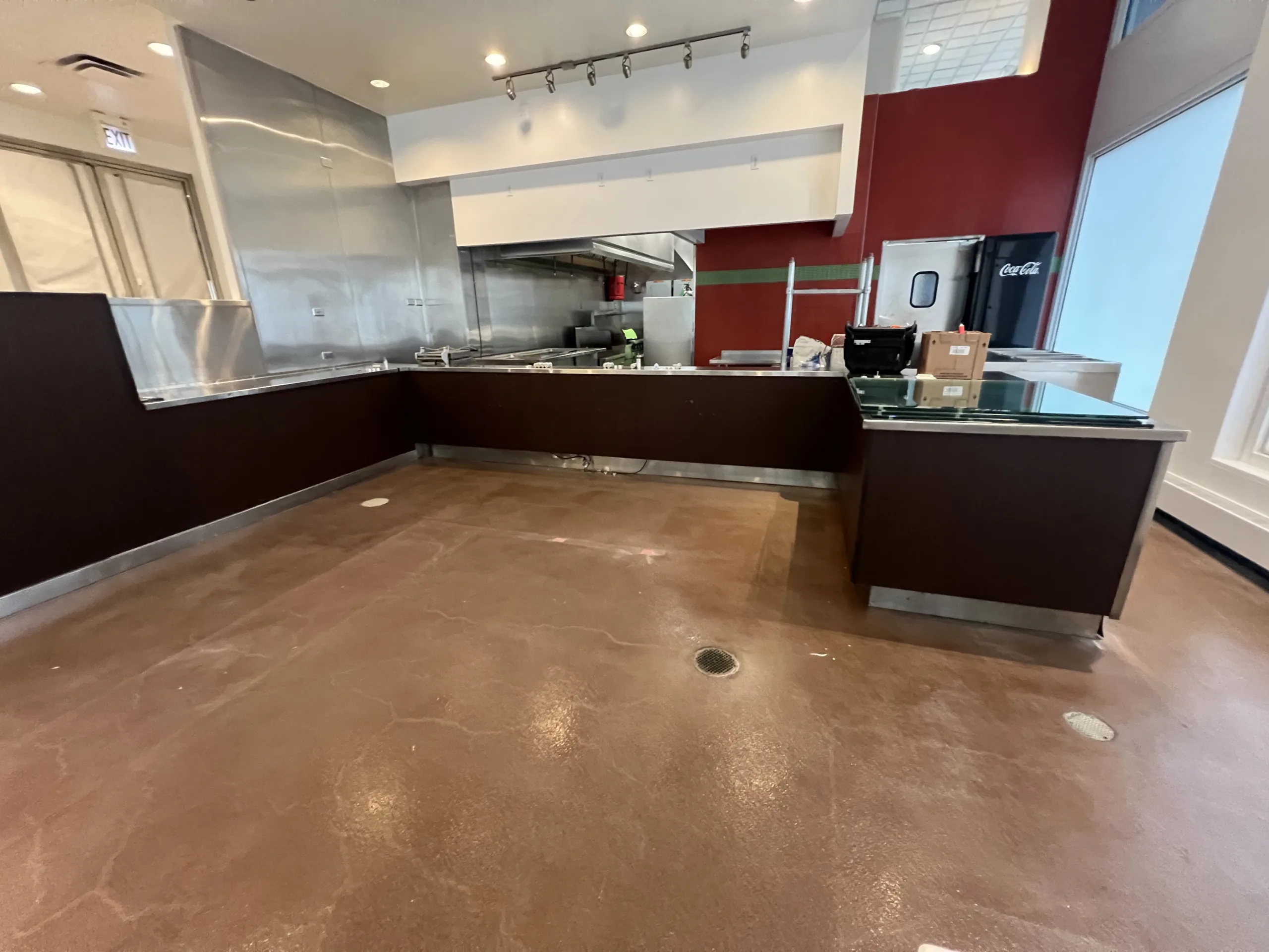 Bakery counter area before remodeling with darker front panels and older interior finishes