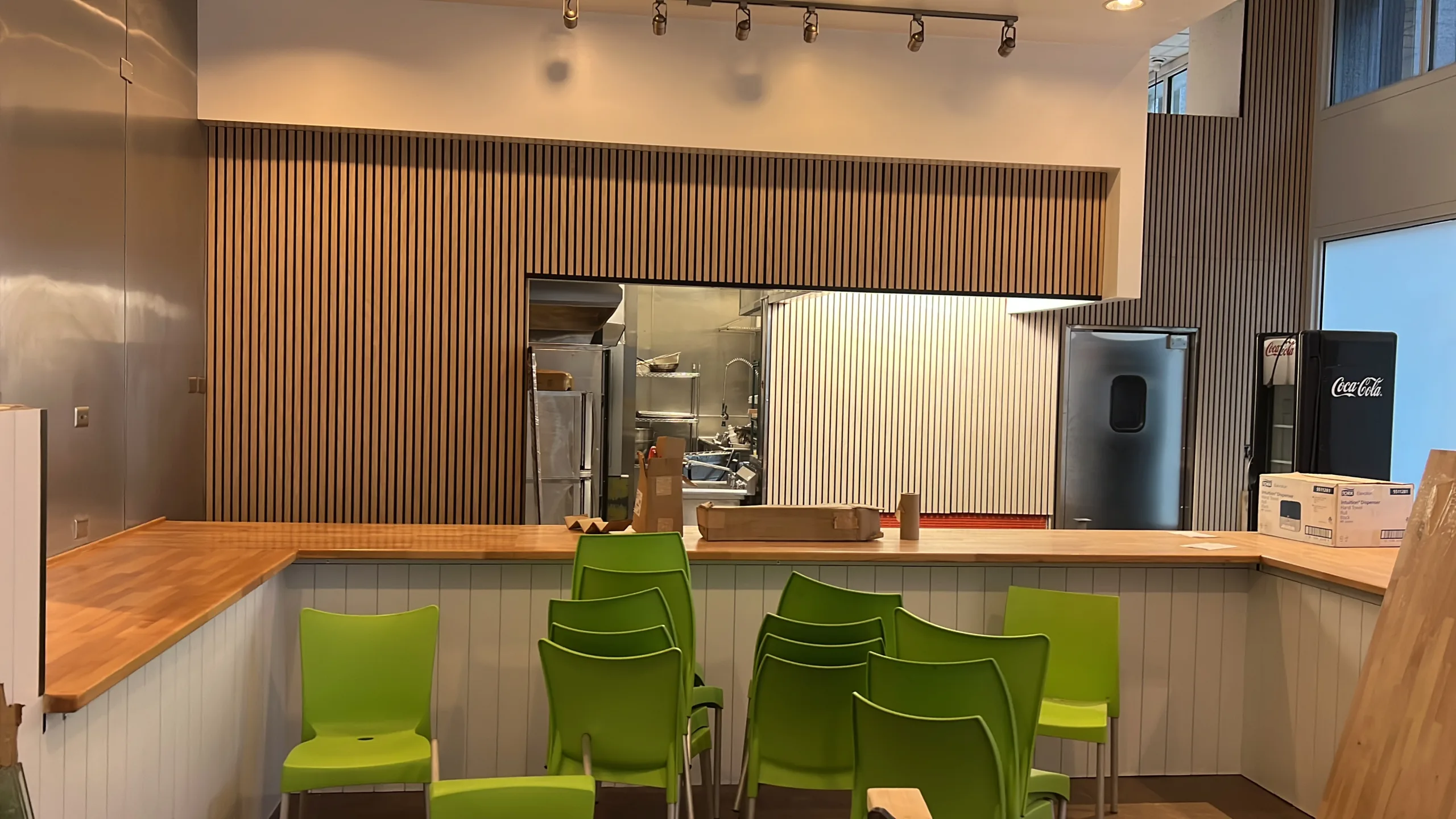 Finish carpentry details around bakery counter edges wall panels and trim transitions