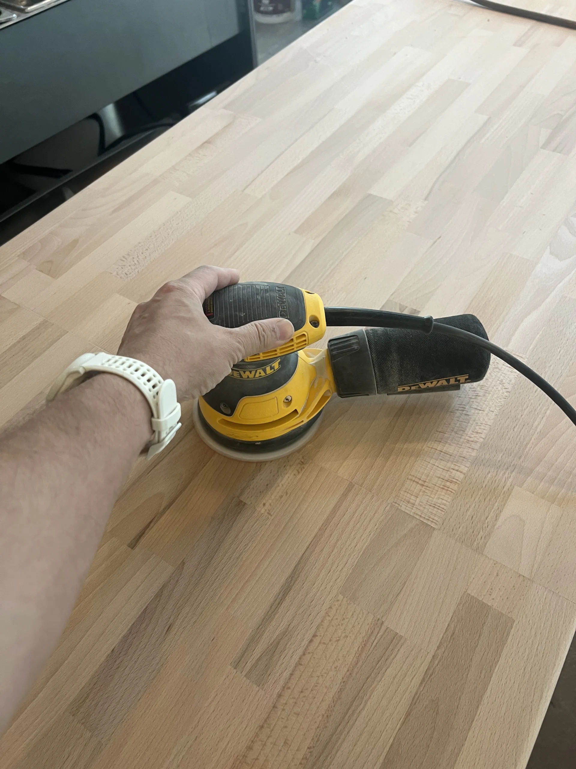 Butcher block counter section fitted and prepared during bakery finish carpentry work