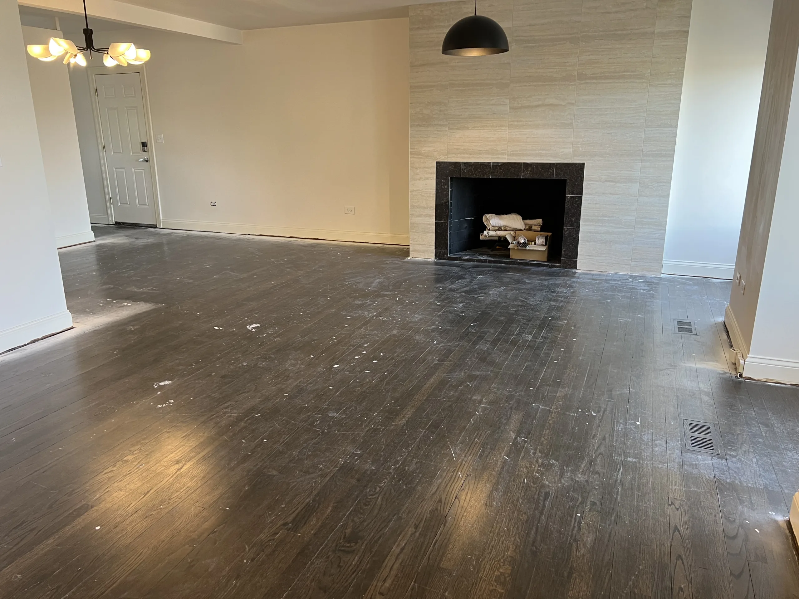 olddarkofficefloorbeforelaminateinstallationchicago Handyman Services in Chicago