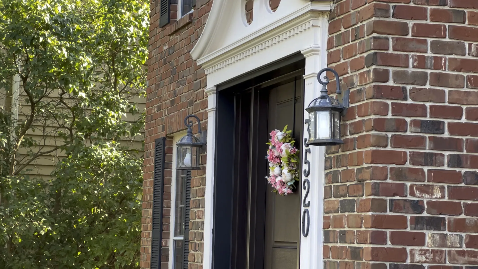 Old exterior wall lights before replacement on brick front entry in Chicago Handyman Services in Chicago
