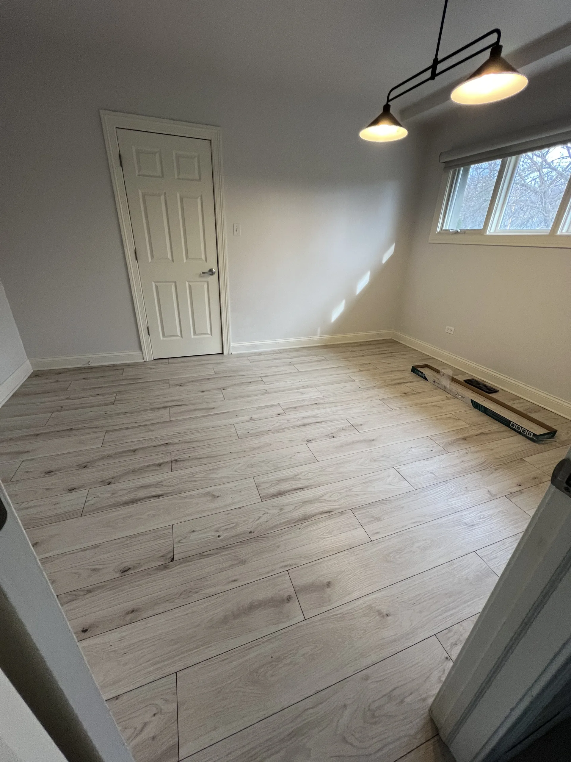 smallofficeroomlightlaminatefloorinstallation Handyman Services in Chicago