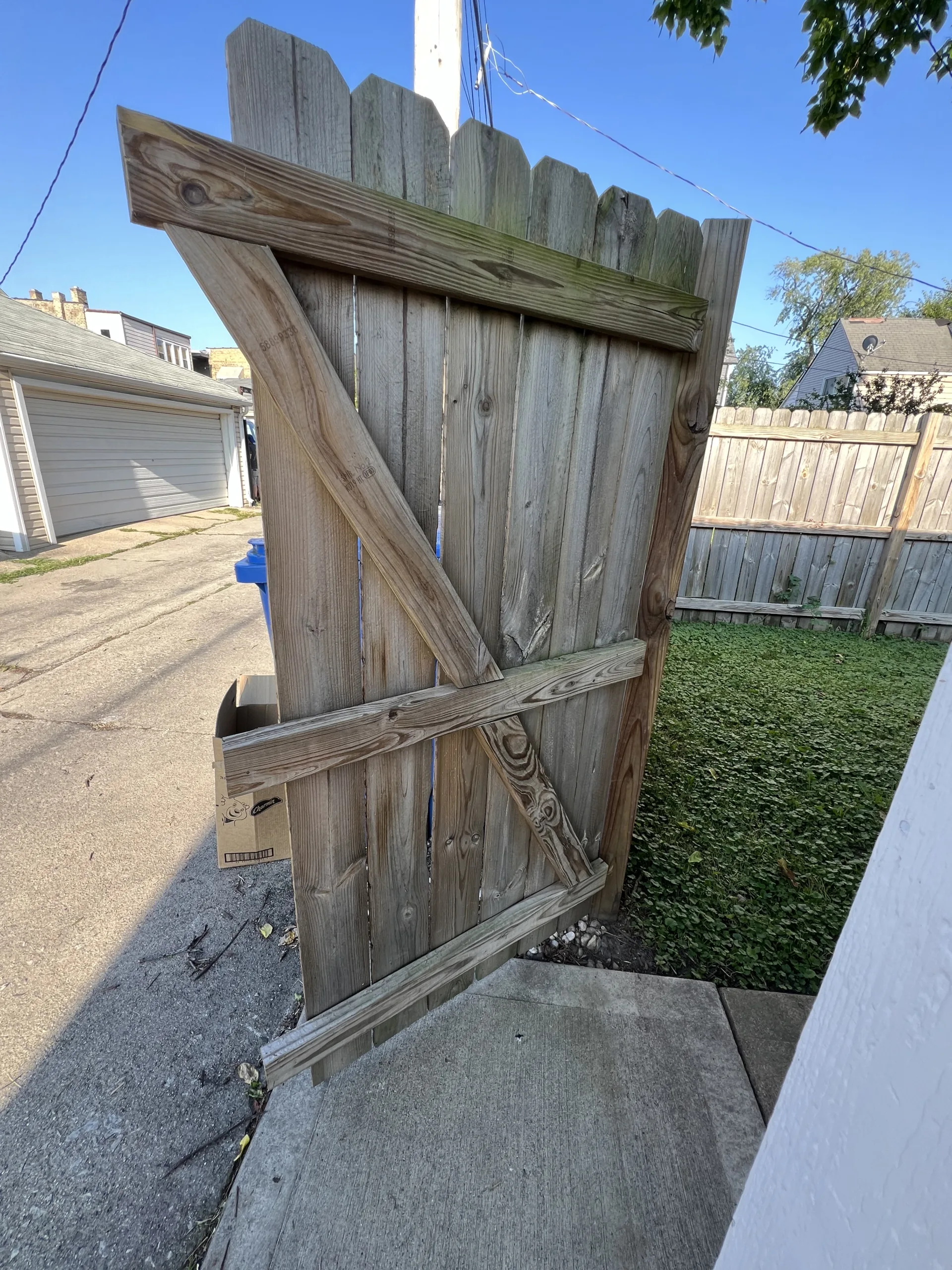 woodfencegatebeforerepairchicago Handyman Services in Chicago